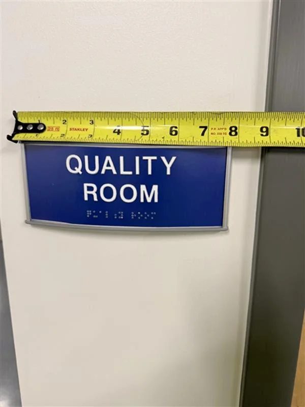An image of the eight inch Quality Room wayfinding ADA sign.